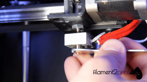 Unscrewing the 3D printer nozzle