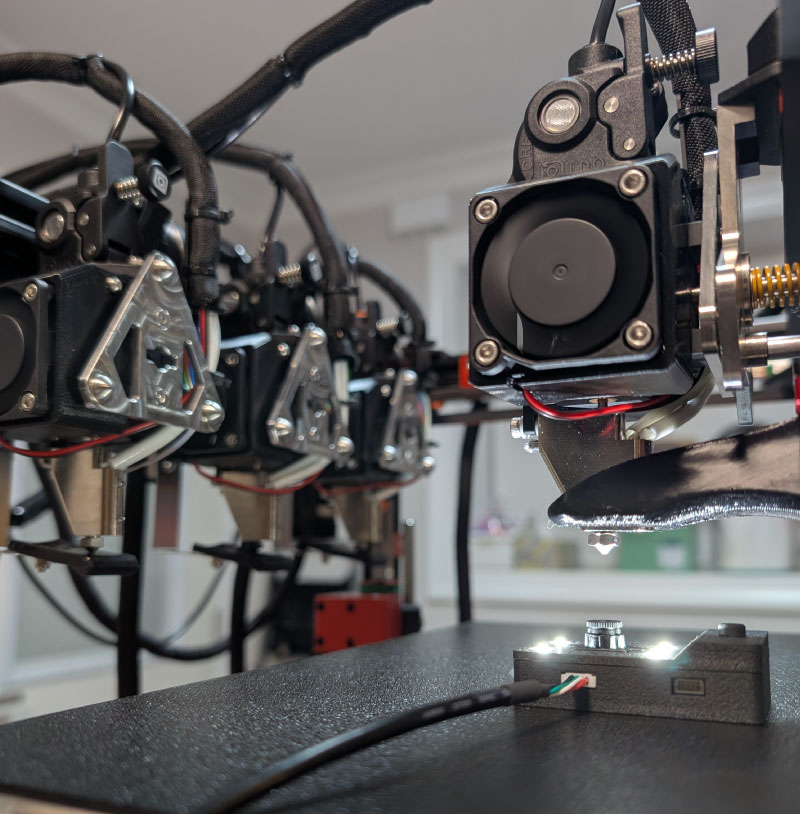 The CXC tool in use with various 3D printers