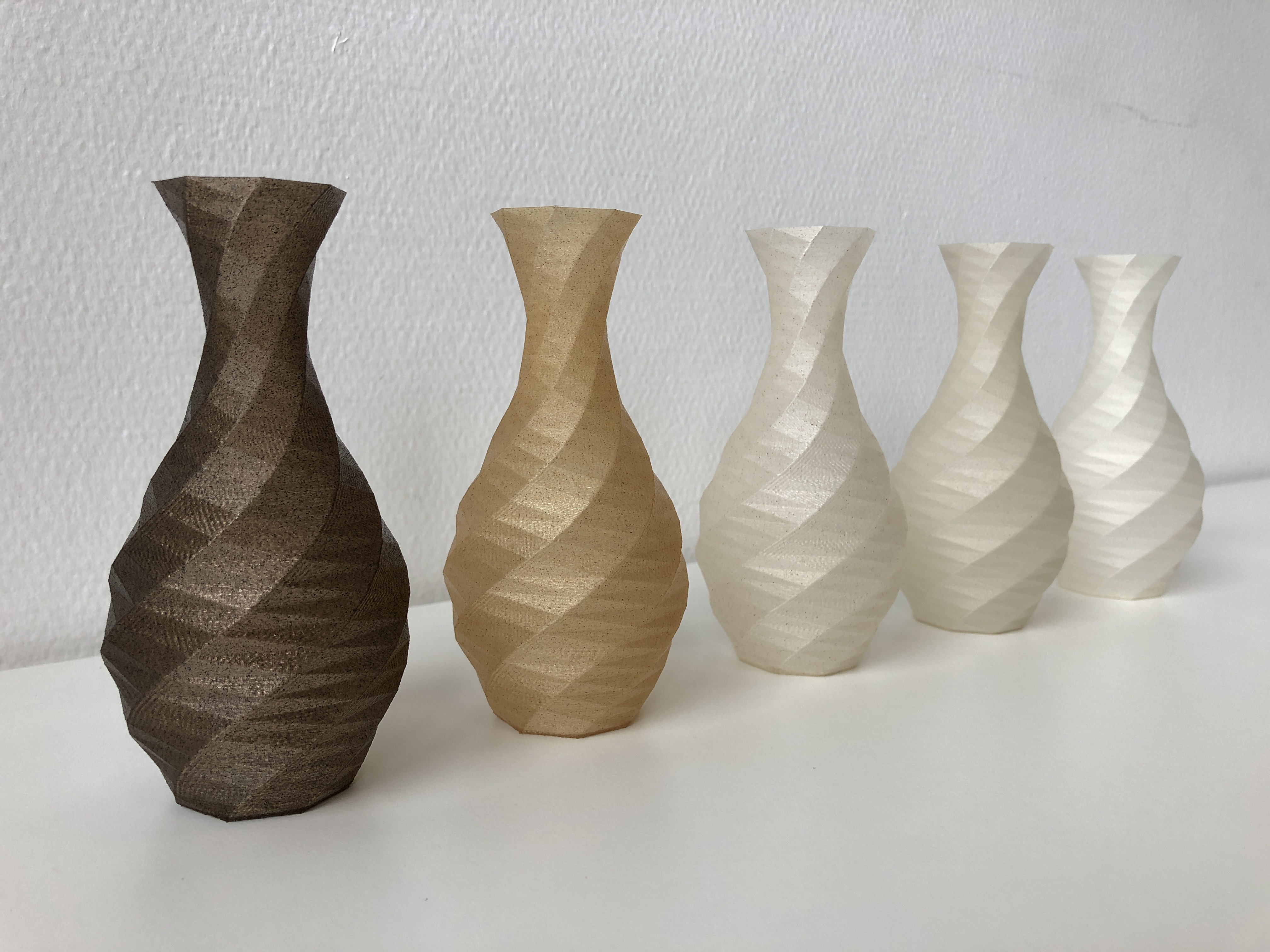 Vases printed with biocomposite filaments.