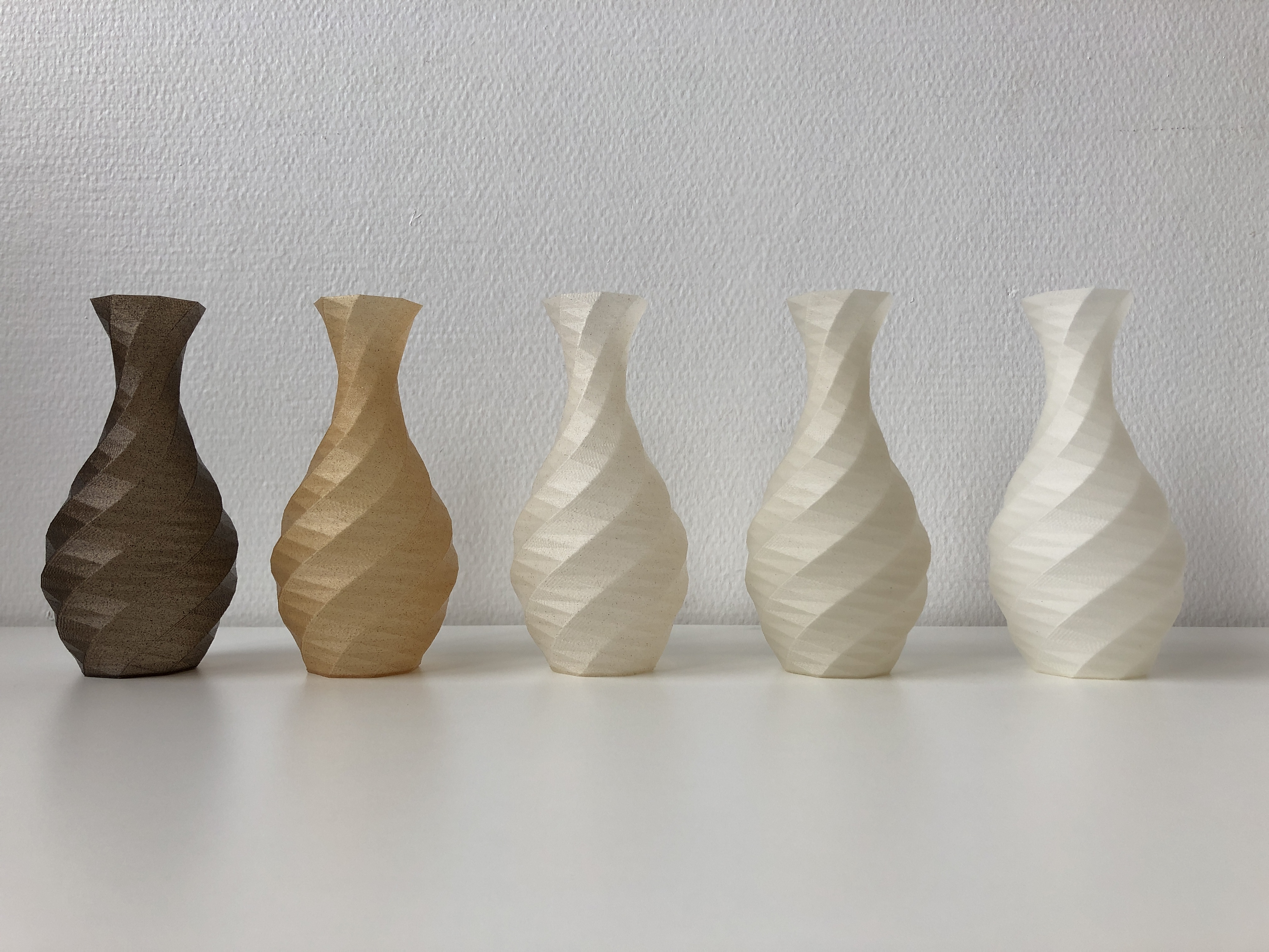 Vases printed with biocomposite filaments.