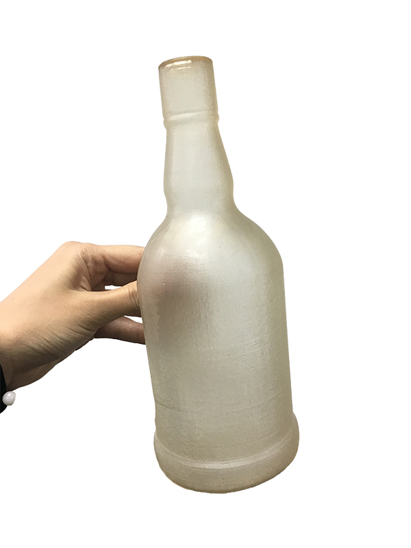 Bottle with cured ZPMMA resin finish